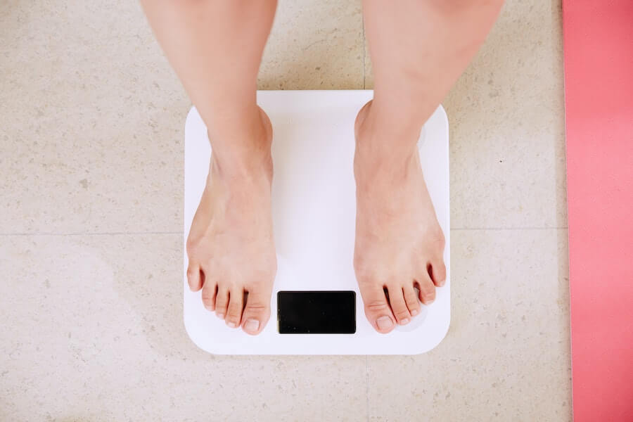 weighing yourself on the scales